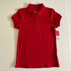 Listing #1 George Red Polo Shirt For Girls Size L (10-12) Features: * Fade Resistant * Shrink Resistant * Wrinkle Resistant Measurements: Shoulder: 3 1/2” Sleeve: 4 5/8” Chest: 15” X 2 = 30” Length: 22 1/2” Fabric Is Made With 60% Cotton, 40% Polyester Perfect For School Uniform #Georgepoloshirt #Redpolo #Schooluniform #Poloshirt #Sizelpolo Red Tops For School, Red Short Sleeve Tops For School, Red Collared Top For School, Polo Shirt Girl, Yellow Polo Shirt, Boys Uniforms, Red Polo Shirt, Boys School Uniform, Red Polo