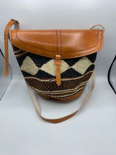 Sisal Kenyan bags that are lined inside and are adjustable. They come in many beautiful colors and designs. Handwoven Beige Leather Bucket Bag, Handwoven Leather Bucket Bag In Natural Color, Beige Leather Handwoven Bucket Bag, Brown Handwoven Jute Bucket Bag, Handwoven Brown Leather Bucket Bag, Brown Handwoven Bucket Bag, Woven Leather Bags In Natural Color, Eco-friendly Woven Brown Bucket Bag, Beige Handwoven Leather Bag