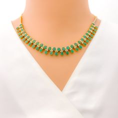 This exquisite 18k yellow gold necklace set, weighing 41.8 grams, features a luxurious design adorned with dazzling diamonds and vibrant emeralds. The yellow gold finish enhances its elegant appeal, making it perfect for any special occasion. The set includes a necklace with a total diamond weight of 2.95 carats, featuring F-G color and VS quality diamonds. The necklace has a length of 15 inches with adjustable 1.1-inch links and is secured with a hook lock. The matching earrings, each measuring Gold Plated Emerald Necklace For Formal Events, Elegant Hand-set Emerald Necklace In Yellow Gold, Elegant Yellow Gold Hand Set Emerald Necklace, Formal Gold Plated Emerald Necklace, Formal Gold-plated Emerald Necklace, 22k Gold Green Jewelry For Anniversary, Green 22k Gold Jewelry For Anniversary, Elegant Green Kundan Necklace For Formal Occasions, Gold Plated Emerald Necklace For Formal Occasions