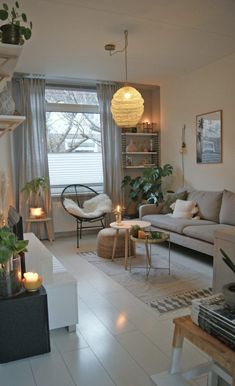 a living room filled with furniture and candles