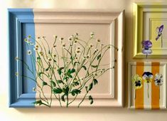 three frames with flowers painted on them in different colors