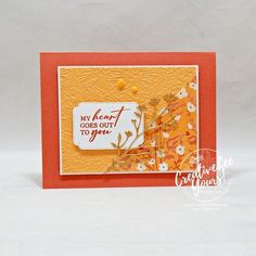 a close up of a card on a white background with an orange and yellow border