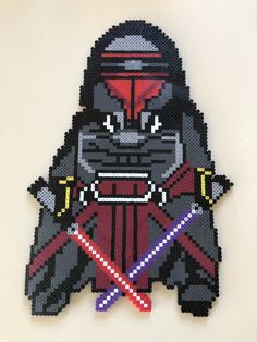 a star wars character made out of perler beads with lightsabes and a darth vader mask