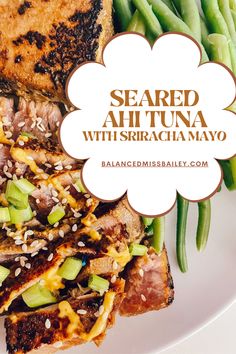 grilled steak and green beans on a white plate with the words seared ah tuna with sriracamayo