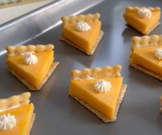 several pieces of pie sitting on top of a cookie sheet