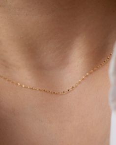 Add a touch of sparkle to any outfit with our Dainty Glitter Chain Necklace. The delicate chain captures the light in a beautiful way, making it a versatile piece to wear alone or layer with other necklaces. Embrace a subtle, yet glamorous look with this glitter daped chain. * 14k Gold * Spring ring clasp Dainty Yellow Gold Chain Necklace For Party, Delicate 14k Gold Filled Chain Necklace, Minimalist Yellow Gold Chain Necklace For Party, 14k Gold Filled Delicate Chain Necklace, Dainty Delicate Chain Necklace For Party, Delicate 14k Gold Chain Necklace, Minimalist Satellite Chain Necklace For Party, Dainty 14k Gold Necklaces For Party, Delicate Chain Necklace For Party