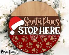 santa paws stop here sign with red and brown background