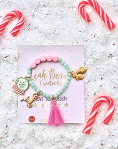 "Our fun Christmas stretch bracelets can be customized! Whether it be your name, your child's name, initials, or even a sentimental number you can make it uniquely your own!  The gold charms might vary, unless you requested the ones shown on the picture.  REMEMBER to put the personalization information in the \"message to seller\" at check-out. Thanks! BRACELET SIZING: Infant 3-12 months: 5\" Toddler: 5.5\" Child: 6\" Small Adult: 6.5\" Please measure your wrist to be sure the bracelets will fit Kids Bead Bracelet, Christmas Bracelet, Christmas Jewelry, Pink Bracelet, Kids Jewelry, Keep Jewelry, Custom Christmas, Gift Packaging, Pink Christmas