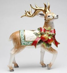 a christmas ornament with a deer on it's head and red bow