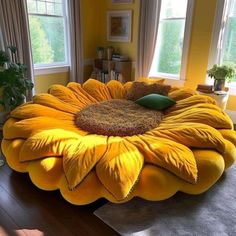 a large yellow flower shaped bed in a living room