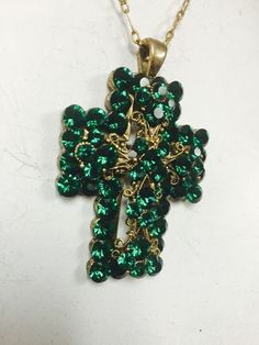 Such an amazing color! 24k gold, Emerald green cross pendant on a 17 inch chain. Great for any occasion. Green Cross Pendant Necklace As Gift, Green Spiritual Cross Pendant Jewelry, Green Cross Necklace For Gift, Emerald Crystal, Crystal Cross, Cross Pendant, Emerald Green, Necklace Etsy, Cross Necklace