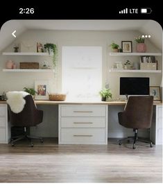 two brown chairs sitting in front of a computer desk