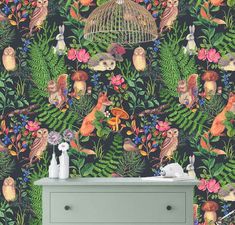 an animal themed wallpaper with birds, flowers and leaves in the foreground is a birdcage