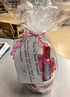 a basket filled with lots of different types of toothbrushes and some paper in it