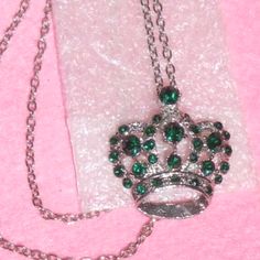 New Necklaces With Assorted Colors Of Crystal Stones In Choices Of: Peridot Emerald Green Blue Sapphire All In Silvertone Alloy Setting. Crowns Are About 1½" Wide. This Listing Is For One. For Sale In My Salon Boutique For $14.95 Each. Chain Sizes Shown Against Measuring Tape. If You Need An Extra Inch, Please Comment & I Will Modify For You. Applicable Discounts: Bundle With Another Item Of The Same Value Or Higher & Get $2 Off Your Total. Reduced No Offers Will Be Sent To Likers. Green Rhinestone Necklace Gift, Green Jewelry With Silver Chain, Silver Rhinestone Costume Necklace For Gift, Silver Rhinestone Necklace Embellished As A Gift, Green Rhinestone Costume Jewelry Necklace As Gift, Crown Pendant Necklace, Crown Pendant, Peridot Green, Crystal Crown