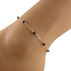 This elegant black crystal anklet features black Swarovski crystals and 14k gold filled chain and fastens with a 14k gold filled lobster clasp. An ideal companion to that little black dress! Please choose the size that you need from the drop-down menu, bearing in mind that the anklet should be approximately one inch larger than the size of your ankle. The anklet will arrive in an attractive gift box. Cheap Adjustable Black Beaded Anklets, Black Beaded Anklets, Affordable Adjustable Black Beaded Anklets, Cheap Black Festival Anklets, Silver Black Beads Anklets, Gold Chain Anklet, Black Anklet, Elegant Anklet, Delicate Gold Jewelry