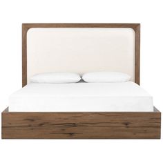 a bed with two pillows on top of the headboard and night stands underneath it