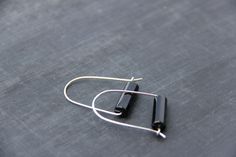 "ATTENTION I am going to be out of the studio EVERY WEEKEND from Friday to Monday. All orders placed Friday to Sunday are going to be processed and shipped following Tuesday and Wednesday, so please, plan accordingly. Less is more for these earrings! U-shape simple earrings hold black polished agate and securely close with hoop-like closure. Simple and elegant, great for everyday or as a subtle statement piece. Color combination is classical, gold or silver and black. it's timeless! You get to c Black Minimalist Small Hoop Earrings, Modern Black Handmade Hoop Earrings, Modern Black Hoop Earrings As Gift, Modern Handmade Black Hoop Earrings, Modern Black Hoop Earrings For Gift, Minimalist Black Earrings For Everyday, Black Minimalist Everyday Earrings, Minimalist Handmade Black Hoop Earrings, Black Minimalist Handmade Hoop Earrings