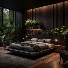 a large bed sitting in the middle of a bedroom next to a plant filled wall