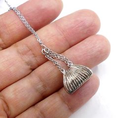 "Brand new signed DBJ sterling silver purse pendant necklace, In good condition, It's 17\" long. Pendant 1\" 1/8 long 5/8\" wide. Weighs 5.9 gram. Thanks." Silver Pendant Jewelry, 16 Inch Length, Nickel-free Pendant Costume Jewelry, Nickel-free Oval Pendant Necklace For Keepsakes, Unique Nickel-free Oval Pendant Necklace, Nickel-free Oval Pendant For Memorial, Silver Purse, Long Pendant, New Sign, Pendant Necklaces