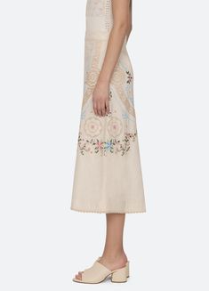 Edwina Skirt – Sea, New York Long Cotton Skirt With Embroidered Hem, Fitted Skirt With Embroidered Hem For Spring, Spring Lace Trim Midi Skirt, Elegant Cotton Embroidered Skirt, Elegant Embroidered Cotton Skirt, Cotton Skirt With Embroidered Hem, Elegant Cotton Skirt With Embroidery, Elegant Bottoms With Embroidered Hem For Spring, Beige Cotton Skirt With Lace Trim