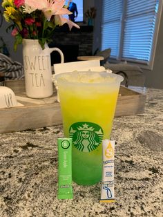 a drink and two lip bales sitting on a counter