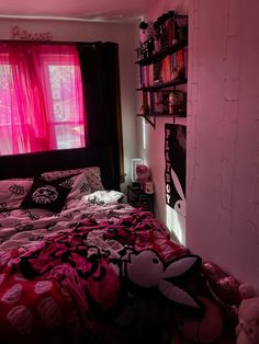 a bedroom with pink walls and black furniture