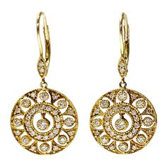 Diamond dangle earrings in 14k yellow gold. The details are as follows : Diamod weight : 1.20 carat ( GH color and VS clarity ) Measurements : length : 1.40 inch Metal : 14 K yellow gold