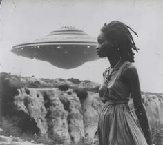 a woman standing in front of an alien ship