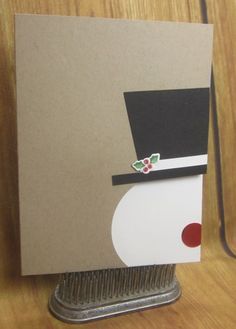 a card with an image of a hat on it sitting on top of a table