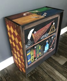 a harry potter book cabinet with books on it