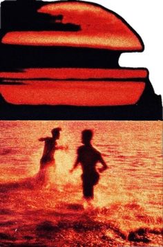 two people are running in the water at sunset or sunrise, and one person is standing on a surfboard