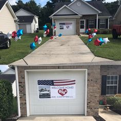 two garages decorated with american flags and balloons