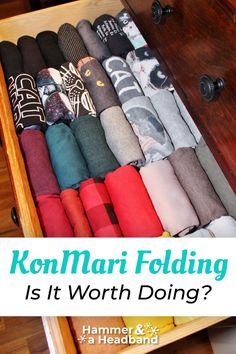 an open drawer filled with socks on top of a wooden floor and text overlay that reads konmari folding is it worth doing?