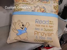 a winnie the pooh pillow on top of a bed with a quote written on it