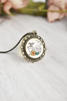 a necklace with an image of a cartoon character on it