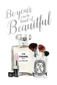 a chanel perfume bottle with brushes and makeup