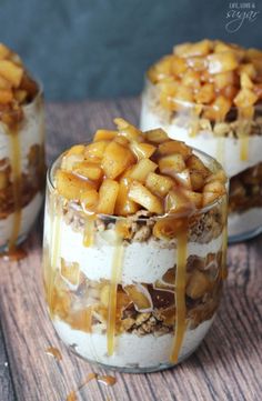 three desserts in glass containers with caramel drizzled on top and toppings