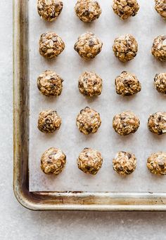 cookie balls on a baking sheet ready to go into the oven