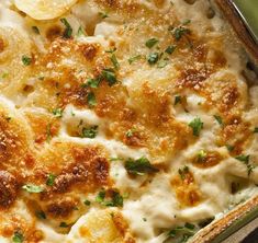 a casserole dish with potatoes and parmesan cheese