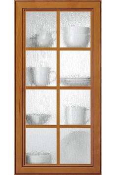 a wooden window with glass panes and dishes on the windows sill, in front of a white background