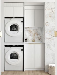 the washer and dryer are next to each other in this white laundry room