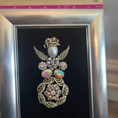 an image of a brooch in a frame