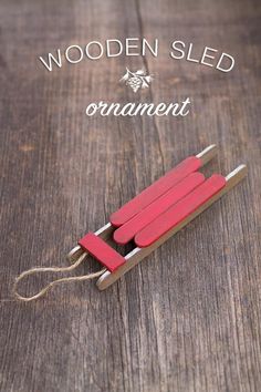 a wooden sled that is sitting on top of a table