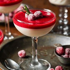 two glasses filled with red and white dessert