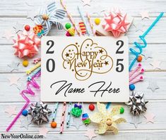 a happy new year sign surrounded by colorful streamers and stars on a white wooden background