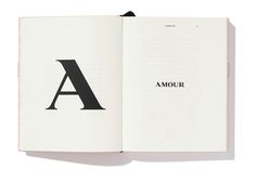 an open book with the letter a in black and white on it's cover