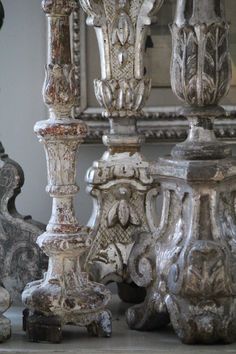 an assortment of antique vases and other decorative items