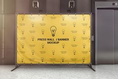 an elevator with a yellow banner on the wall next to two doors that say press wall / scanner mockup