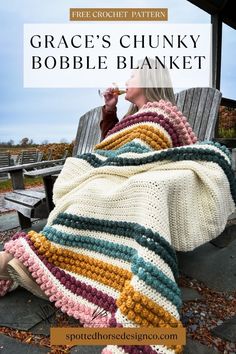 a woman sitting on a bench with a crocheted blanket over her face and the text, grace's chunky bobble blanket